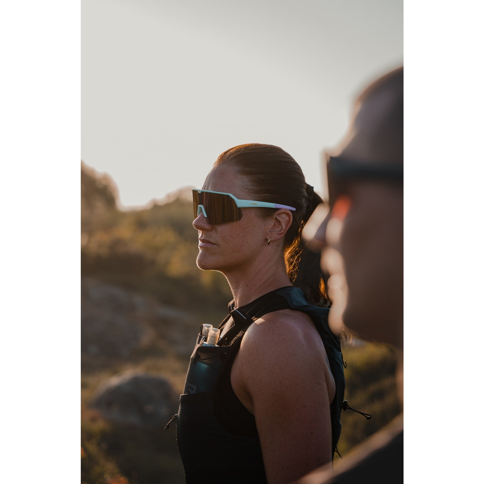 Side view of runner wearing tripoint 001 treriksroset sunglasses