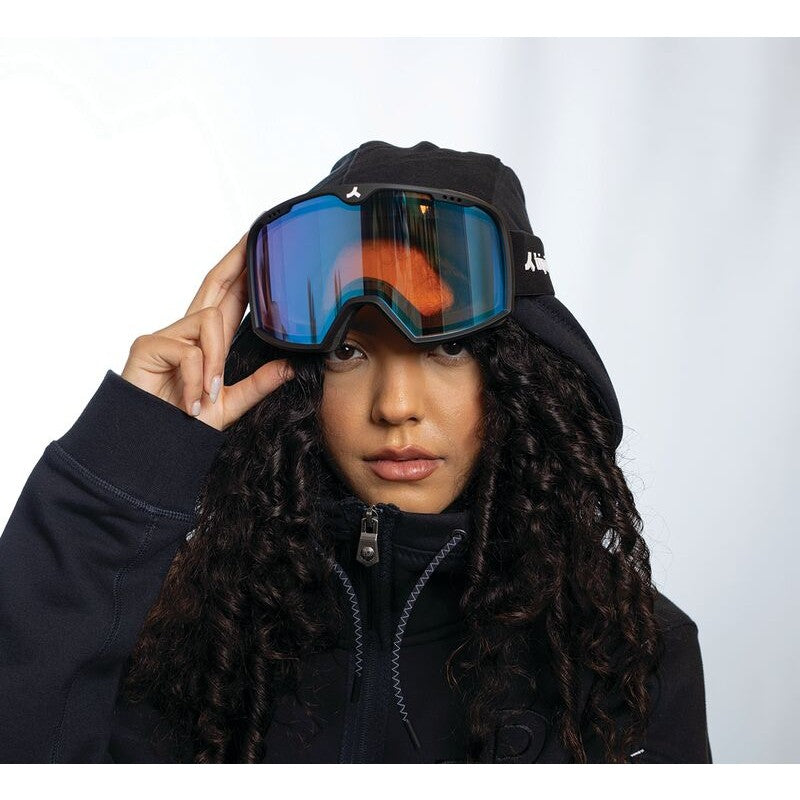 Model wearing tripoint 102 snow sport goggles with black frame & orange-blue multi lens